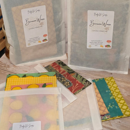 beeswax wraps with visible branding on a wooden surface